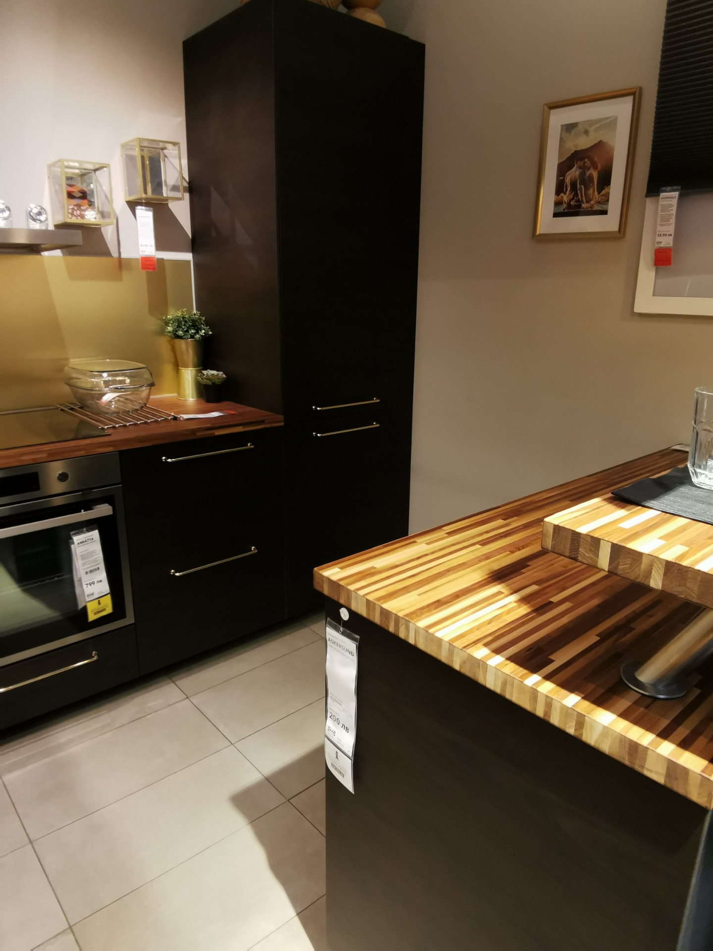 IKEA Askersund dark brown kitchen with Jutis smoked glass door